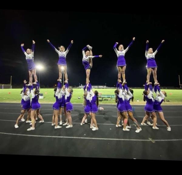 Five different cheerleading pyramids